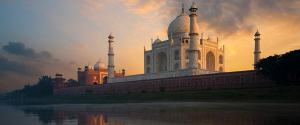 The Taj Mahal at sunrise as seen from the Mentab Bagh Gardens.